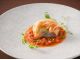 魚料理:本日おすすめの魚とアーサ風味のムース仕立て パートブリック包み焼き 完熟トマトとスーチカーの琉球ベルジュソース