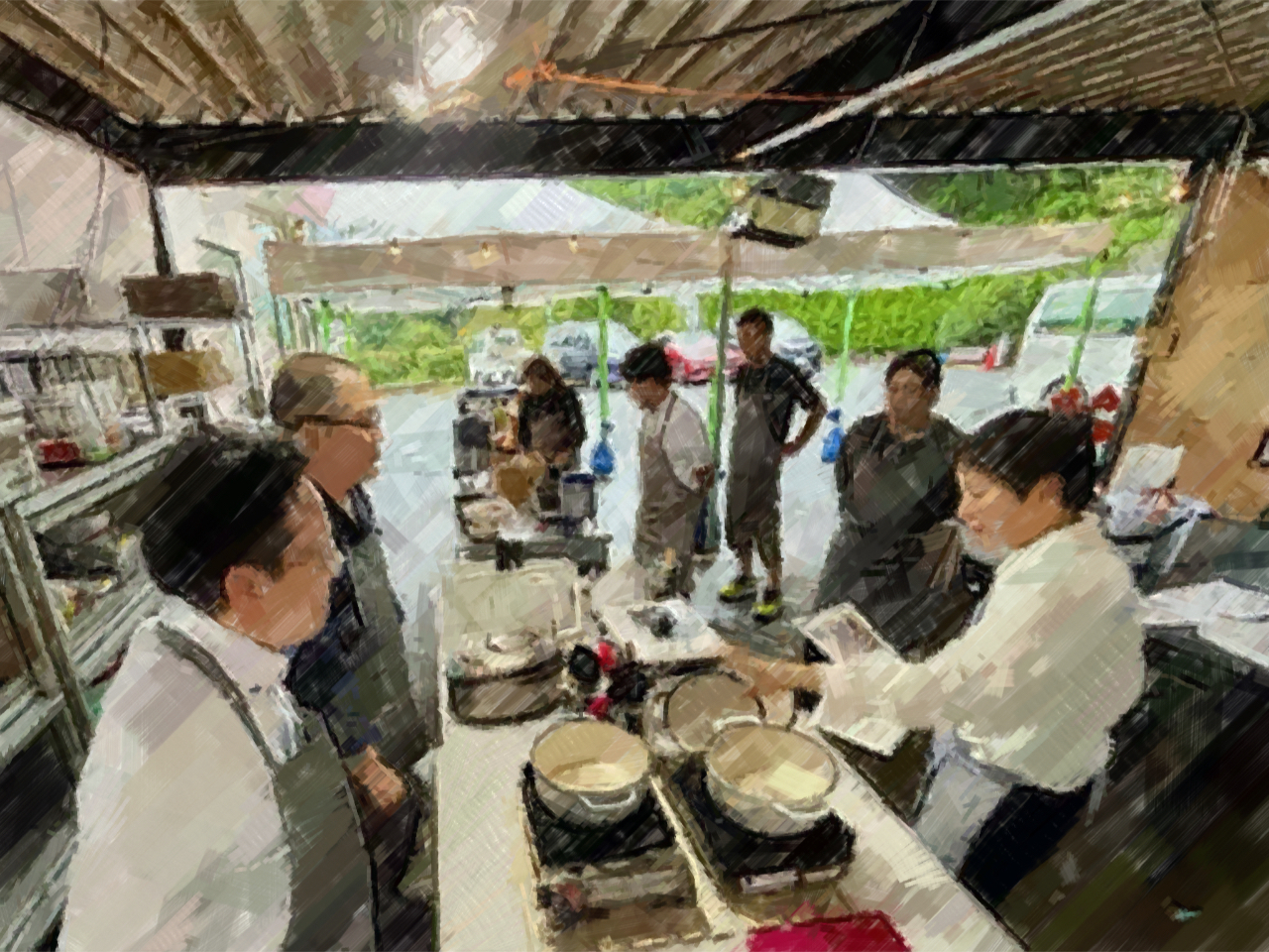 エプロンつけてレシピの説明から始まります。コミュニケーションキッチンでは調理時間が懇親を深める大切な時間となります。