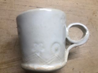 ワラを焼いた灰の成分がメインの釉薬です。真っ黒な灰からミルク色に焼き上がるのです。焼き物ってホント不思議です。